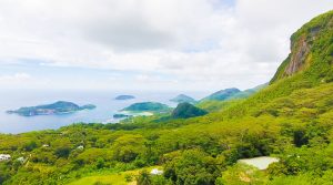 Drone view of ocean, islets, mountains and jungle in Morne seychellois national park, north Mahe, Seychelles