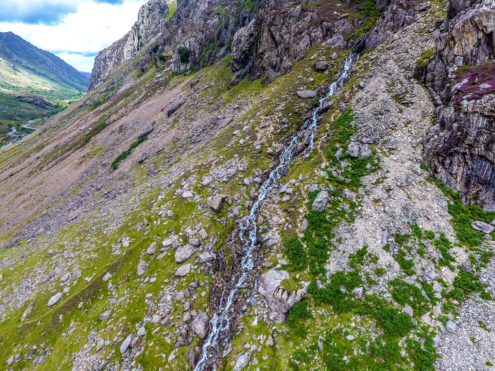 Waterfall flowing down a mountain in Snowdonia National Park, Wales