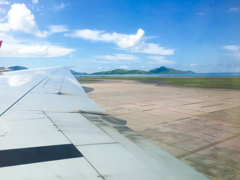 View out of plane window over Mahé island, Seychelles