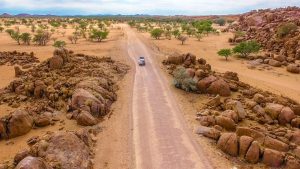 Drone view of Toyota Hilux self-drive through the desert in Damaraland, Namibia, Africa