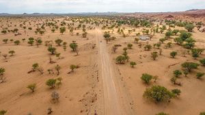 Drone view of Toyota Hilux self-drive through the desert in Damaraland, Namibia, Africa
