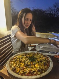 Ella with Biltong pizza in Onguma Reserve near Etosha National Park in Namibia, Africa