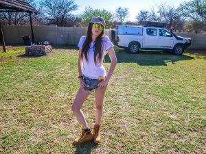 Ella with Toyota Hilux 4x4 with roof-top tent at Ombo Rest Camp in Namibia, Africa