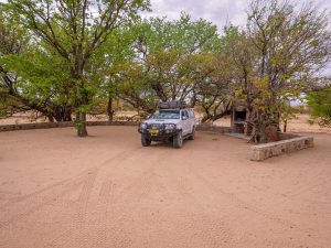 Toyota Hilux 4x4 with roof-top tent in Madisa desert campsite in Damaraland in Namibia, Africa