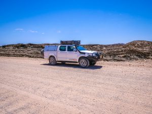 Toyota Hilux 4x4 with roof-top tent at Kuiseb Pass canyon in Namib Desert, Namibia, Africa