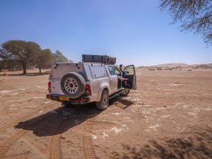 Toyota Hilux self-drive 4x4 in Sossusvlei with sand dunes, Namib Desert in Namibia, Africa