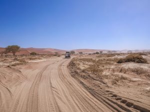 Toyota Hilux self-drive 4x4 in Sossusvlei with sand dunes, Namib Desert in Namibia, Africa