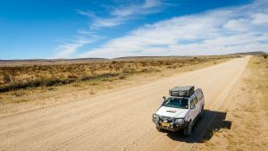Drone view of Toyota Hilux 4x4 self-drive road-trip through Namibia, Africa