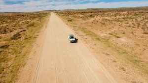 Drone view of Toyota Hilux 4x4 self-drive road-trip through Namibia, Africa