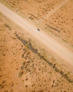 Drone view of Toyota Hilux 4x4 self-drive road-trip through Namibia, Africa