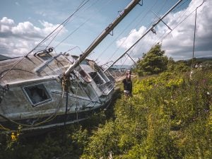 Ella McKendrick by Sailing Boat Shipwreck on Corpach Beach in Scotland