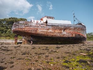 Ella McKendrick with the Corpach Shipwreck in Fort William, Scotland