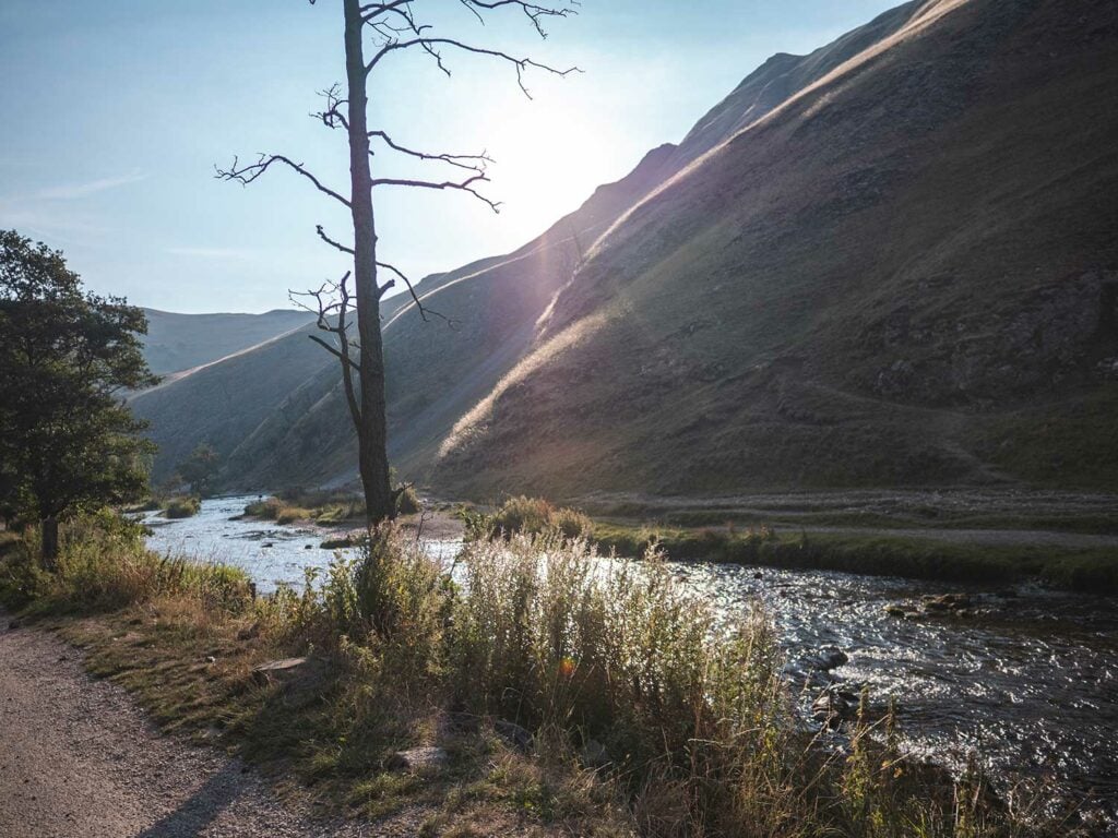 The River Dove with the sloping flanks of Thorpe Cloud in the background
