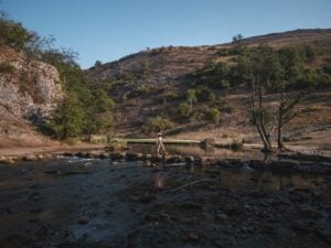 Ella Crossing the Dovedale Stepping Stones in the Peak District