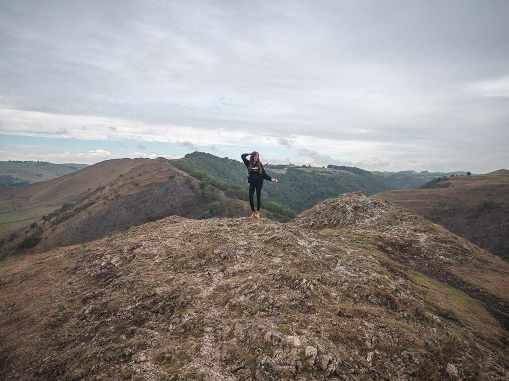 Ella on the top of Thorpe Cloud in the Dovedale Valley, Peak District