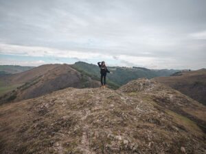 Ella on the top of Thorpe Cloud in the Dovedale Valley, Peak District