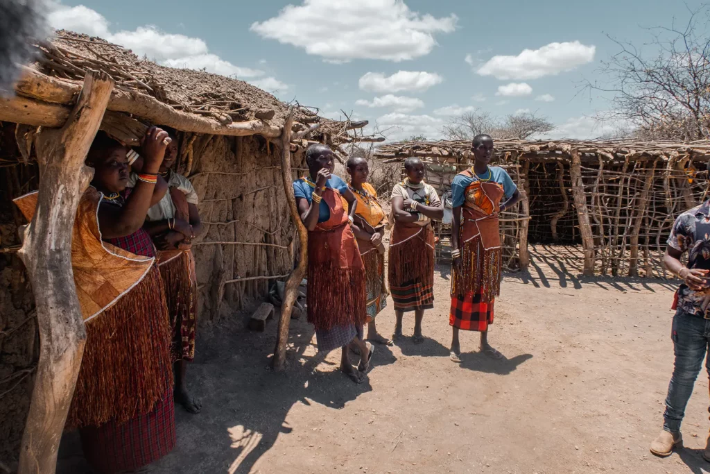 Datoga women Tanzania standing outside their traditional houses