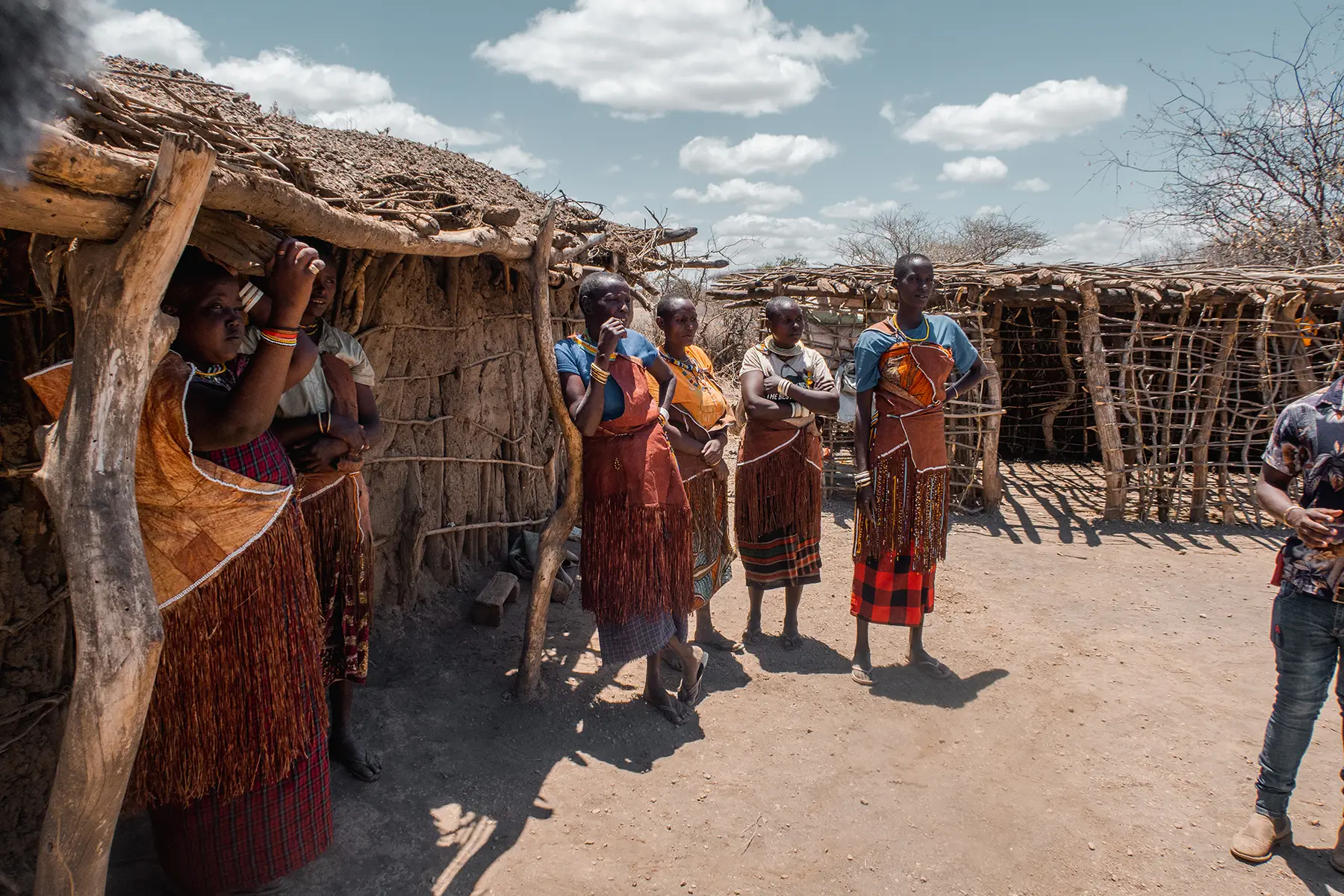Datoga women Tanzania standing outside their traditional houses