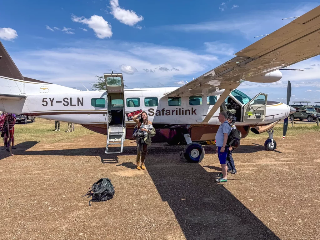 Ella McKendrick disembarking a small 12 seater safari plane (Cessna Grand Caravan)