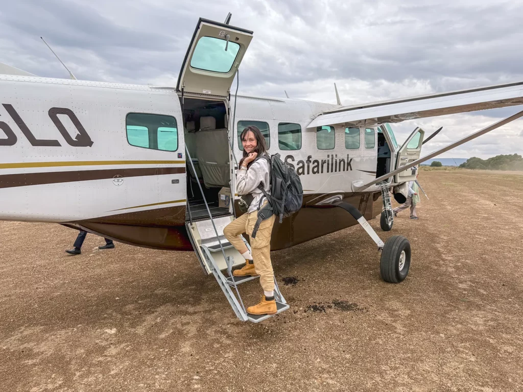 Ella McKendrick boarding a small 12 seater safari plane (Cessna Grand Caravan)
