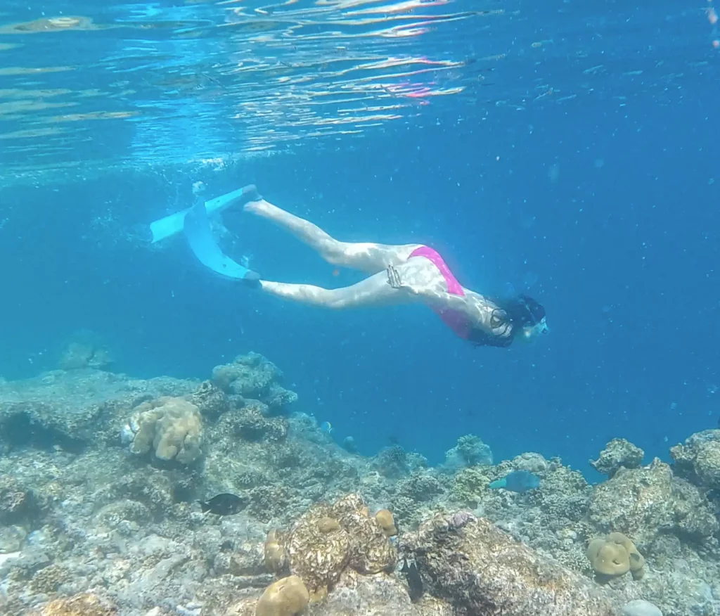 Ella McKendrick snorkelling by reef, Zanzibar