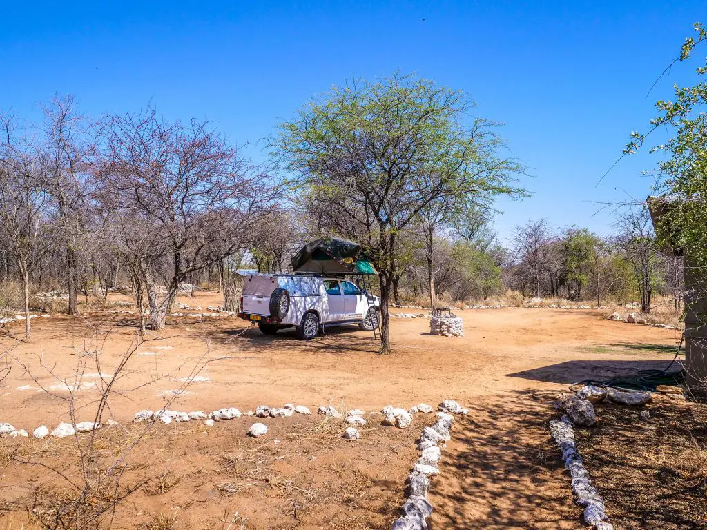 Toyota Hilux 4x4 with roof-top tent in Onguma Reserve near Etosha National Park in Namibia, Africa