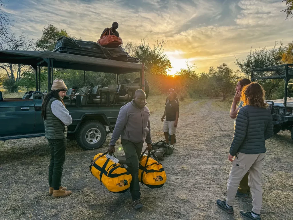 Ella Mckendrick's local tour operator offloading my bags in Khwai, Botswana