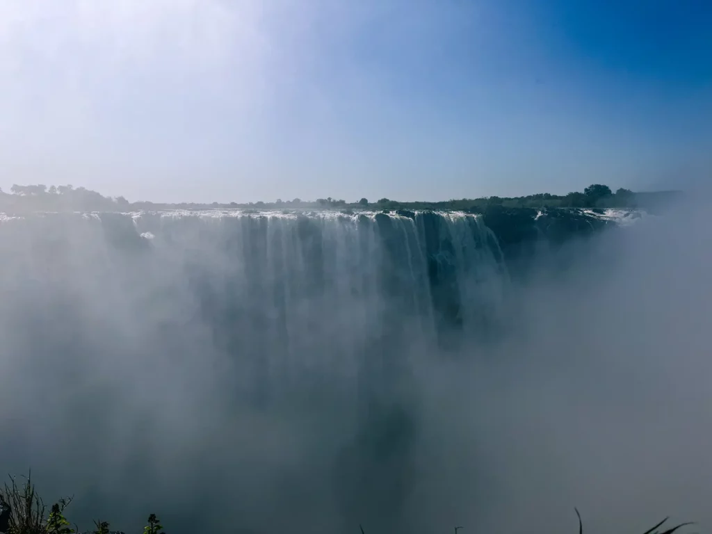 Victoria Falls are very full in June so there is a lot of spray, Zimbabwe