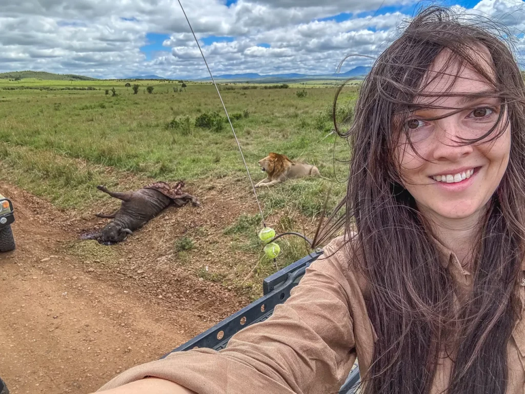 Ella Mckendrick selfie with male lion and kill in Masai Mara, Kenya