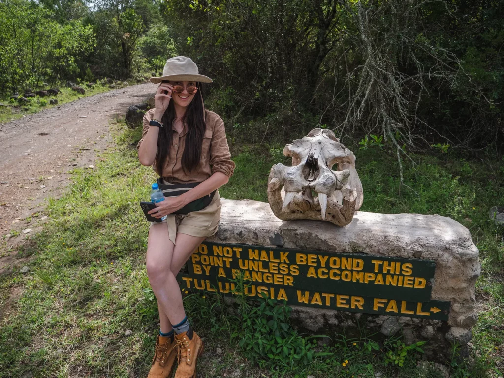Ella Mckendrick next to a hippo skull in Arusha National Park, Tanzania
