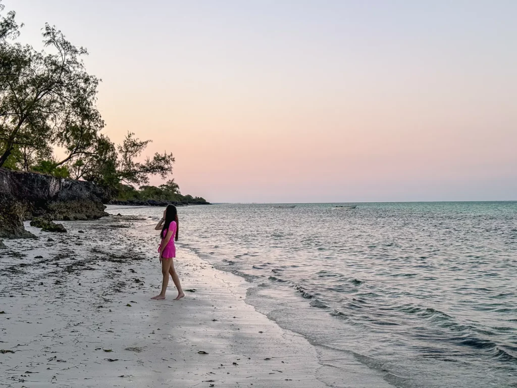 Ella McKendrick wondering down the beautiful white sand beaches of Zanzibar