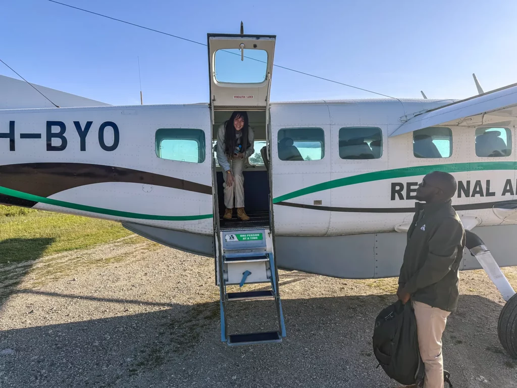 Ella McKendrick on small safari plane (Cessna Caravan) flying to the Serengeti in Tanzania