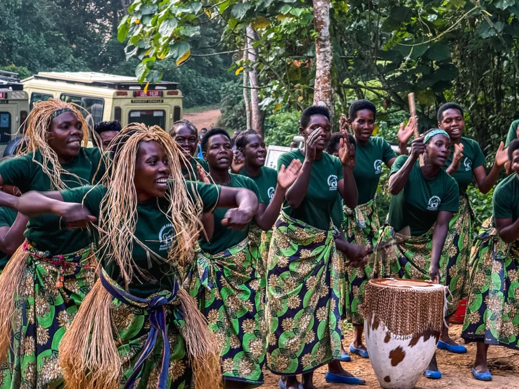 Local women dancing to give us good luck before we start out gorilla tracking at Bwindi Impenetrable Forest, Uganda