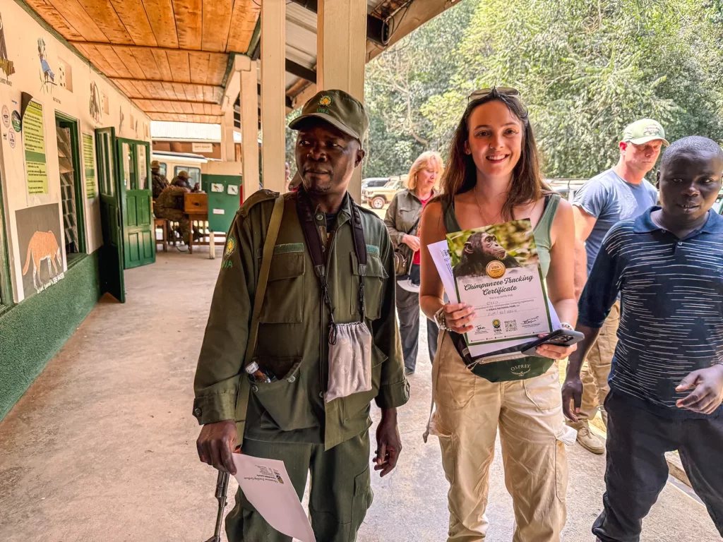 Ella McKendrick receiving a chimpanzee tracking certificate in Kibale Forest National Park, Uganda
