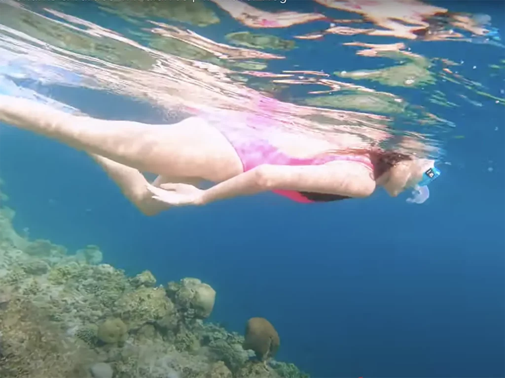 Ella McKendrick snorkelling over a reef