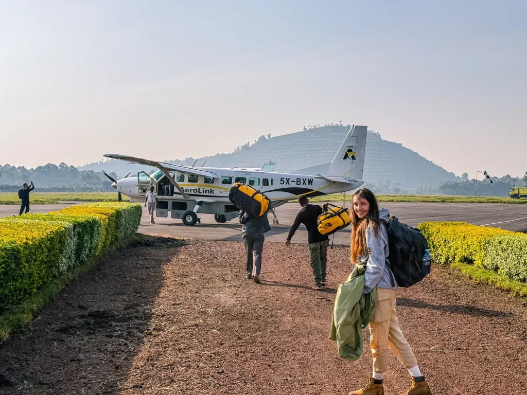 Ella McKendrick boarding a safari plane at Kisoro Airport after gorilla tracking in Uganda