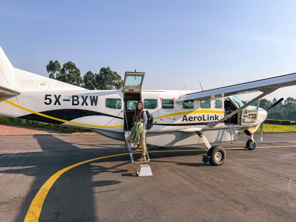 Ella McKendrick boarding a safari plane at Kisoro Airport after gorilla tracking in Uganda