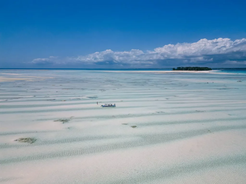 Ella McKendrick on a boat in front of Mnemba Island, Mnemba Marine Park, Zanzibar