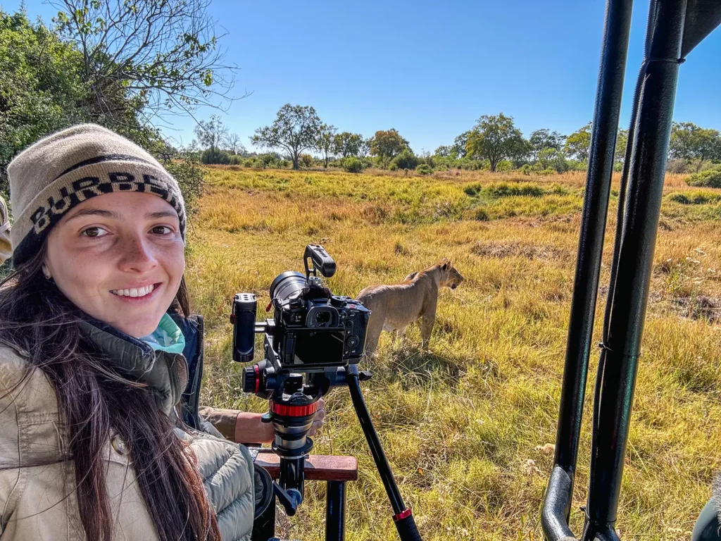 Ella McKendrick photographing lion in Khwai Conservation Area, Okavango Delta, Botswana