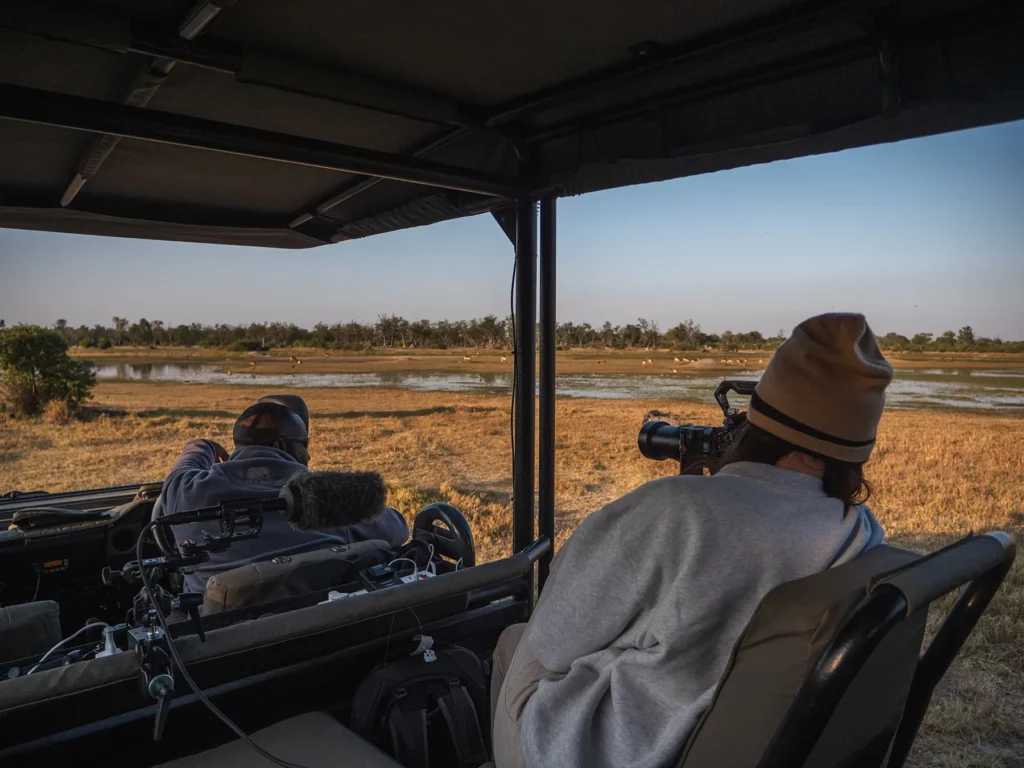 Ella Mckendrick photographing red lechwes in Moremi Game Reserve, Okavango Delta, Botswana