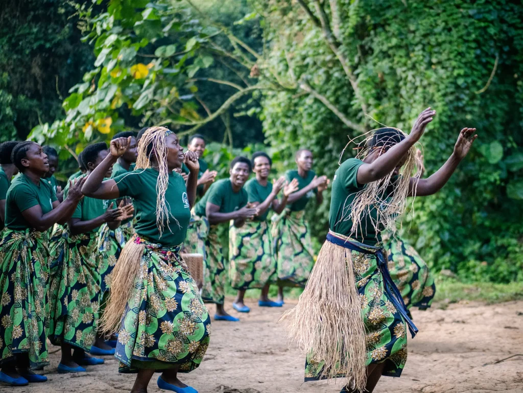 Local women dancing to give us good luck before we start out gorilla tracking at Bwindi Impenetrable Forest, Uganda