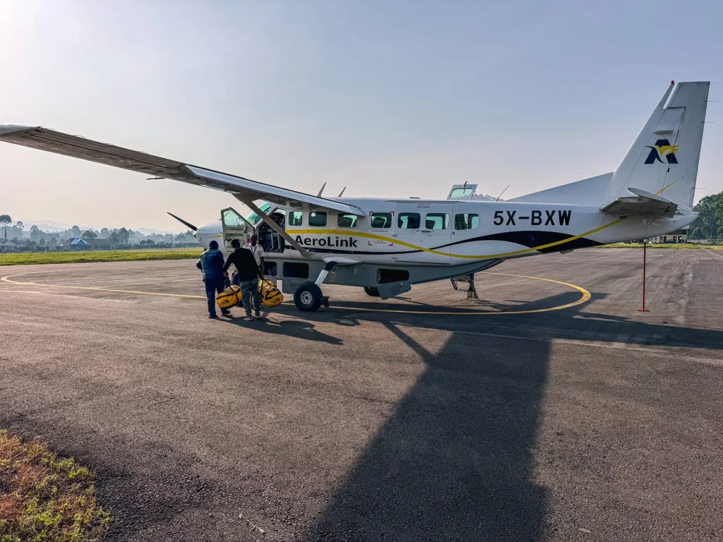 Ella McKendrick boarding a safari plane at Kisoro Airport after gorilla tracking in Uganda