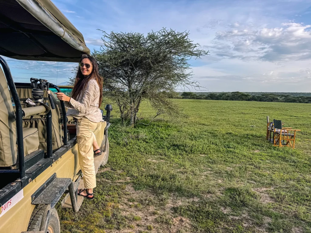Ella McKendrick on an open-sided Land Cruiser vehicle in Ndutu in Southern Serengeti, Tanzania