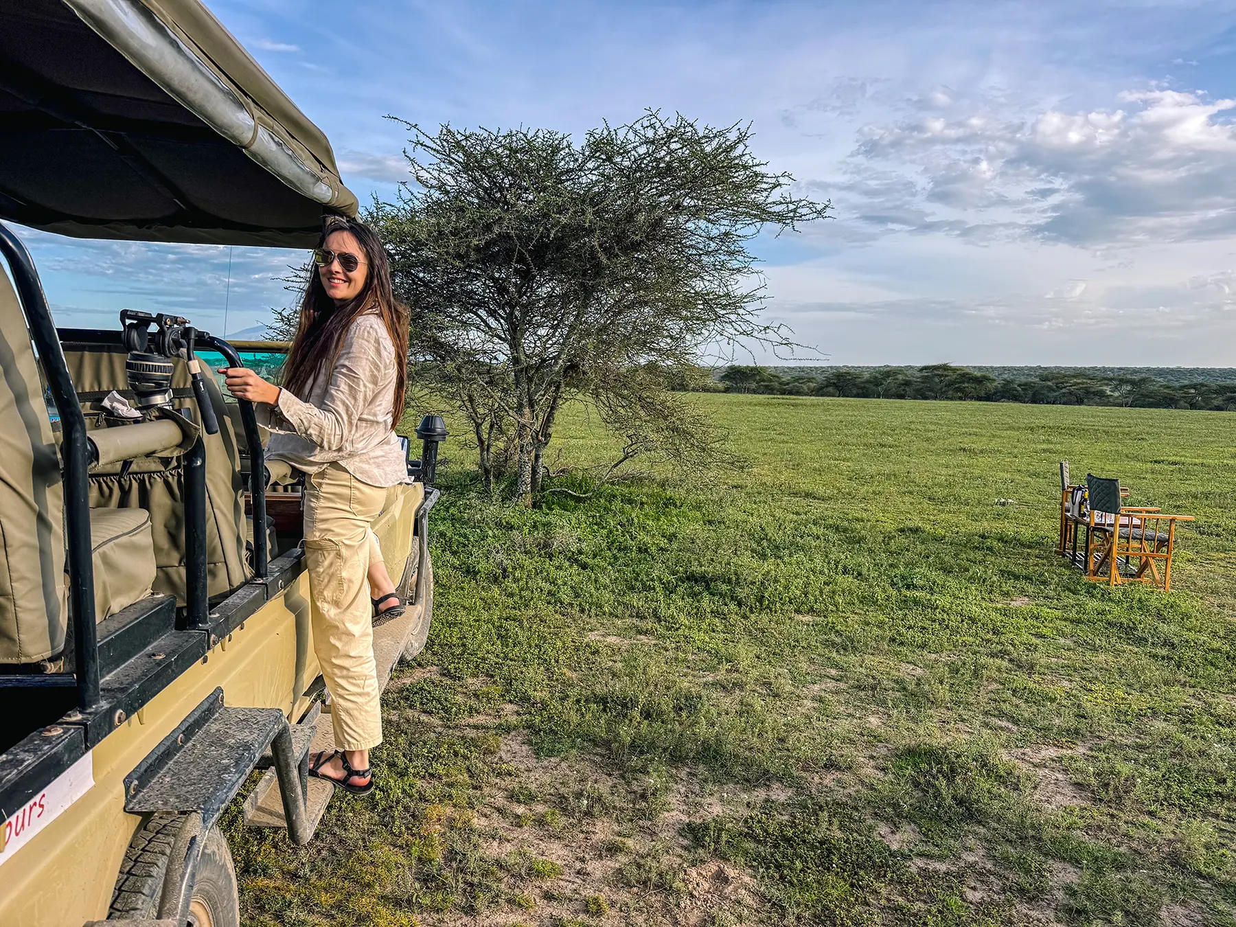 Ella McKendrick on an open-sided Land Cruiser vehicle in Ndutu in Southern Serengeti, Tanzania