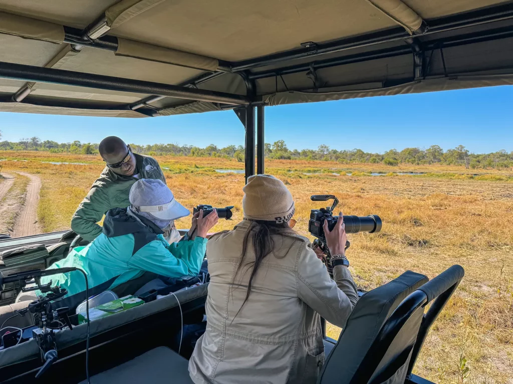 Ella Mckendrick photographing lions Khwai, Botswana
