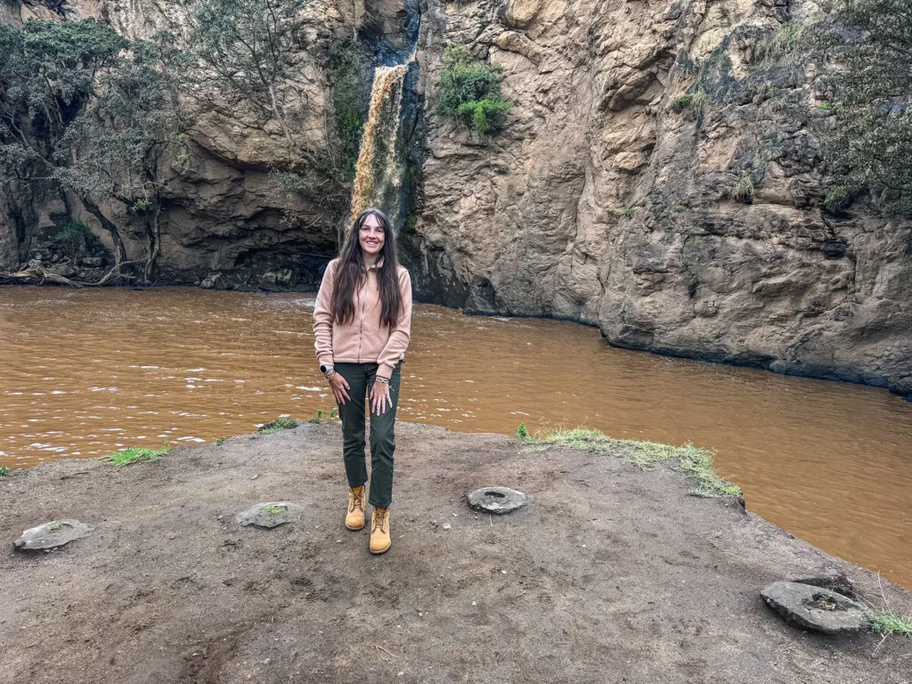 Ella McKendrick by a waterfall in Lake Nakuru National Park