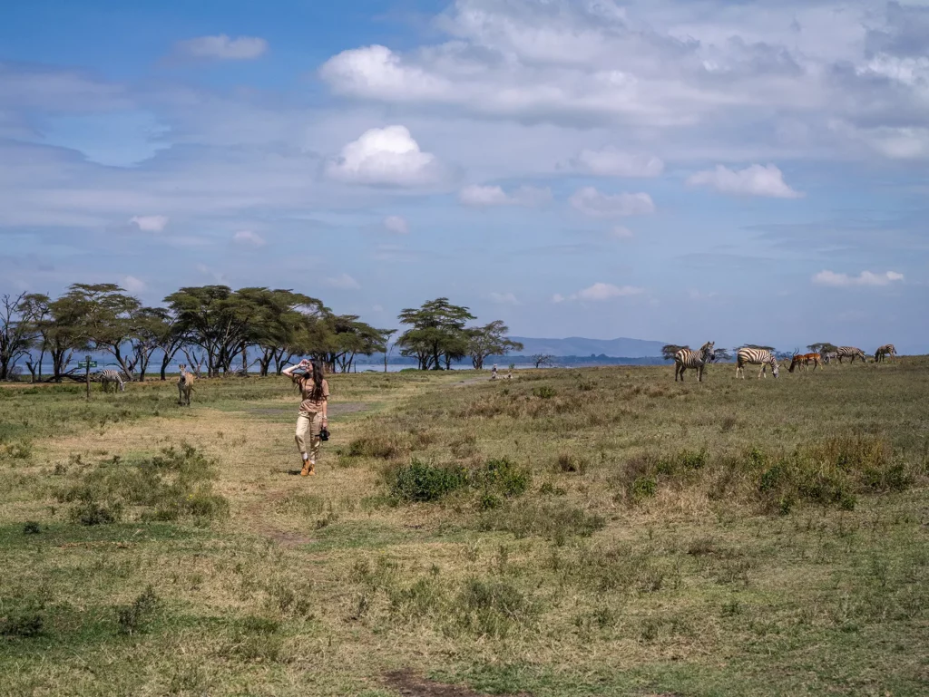 Ella McKendrick photographing zebras on Crescent Island at Lake Naivasha, Kenya