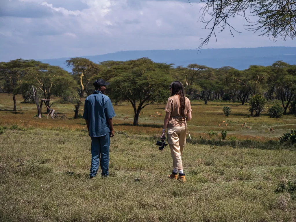 Ella McKendrick and guide on walking safari at Crescent Island, Lake Naivasha, Kenya