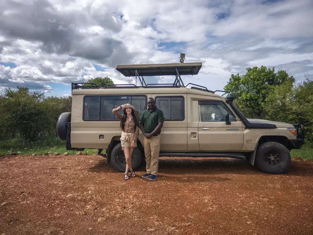 Ella McKendrick by safari truck in Kenya