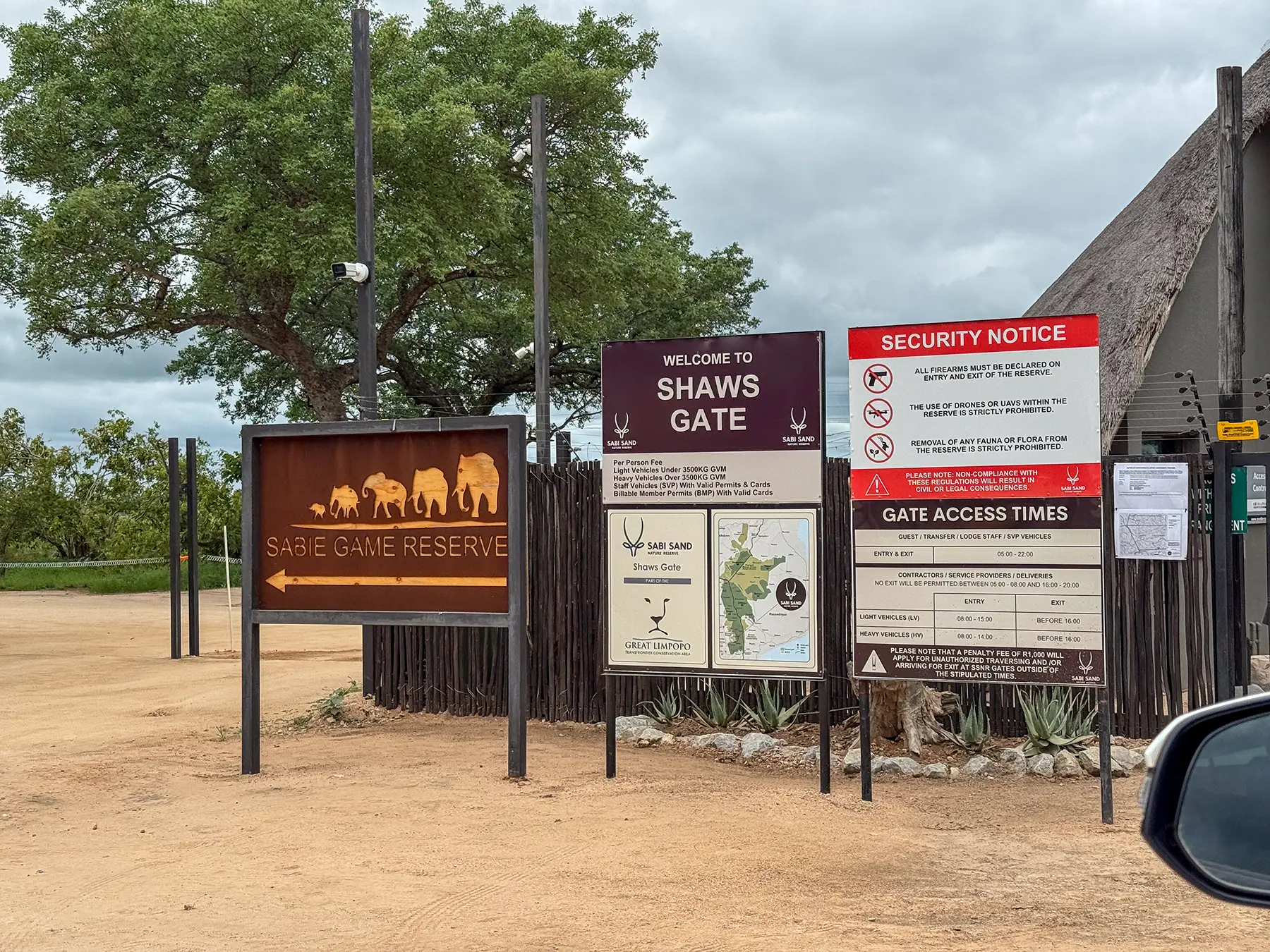 Shaws Gate entrance signs with a Sabie Game Reserve directional sign and welcome boards on safari in Sabi Sand Game Reserve, South Africa